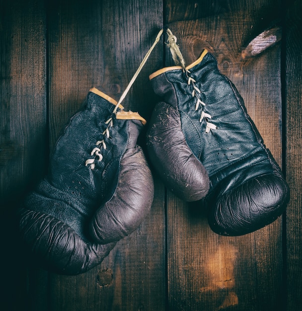 Premium Photo | Pair of very old brown boxing gloves