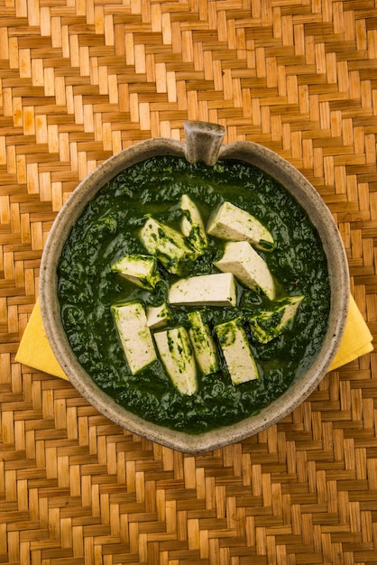 Premium Photo | Palak paneer or spinach and cottage cheese curry is a ...