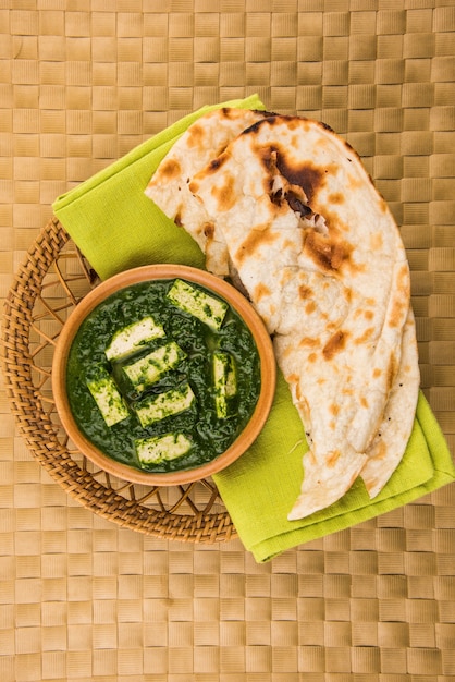 Premium Photo | Palak paneer or spinach and cottage cheese curry is a ...