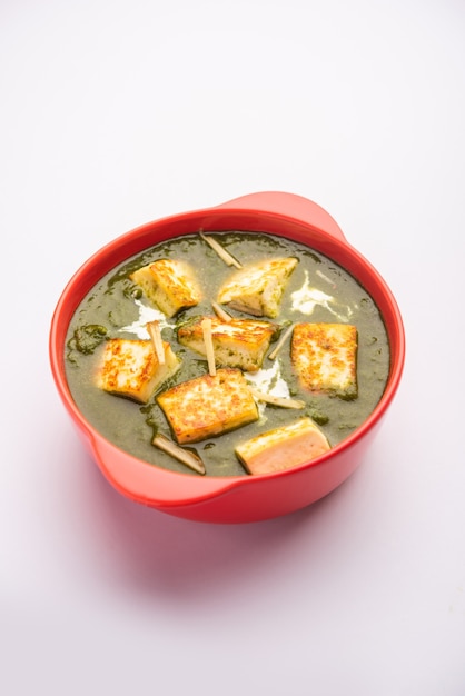 Premium Photo | Palak paneer or spinach and cottage cheese curry served ...