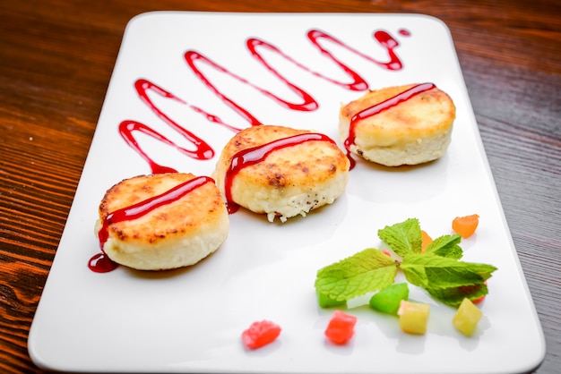 Pan Fried Cottage Cheese Patties With Strawberry Jam Photo