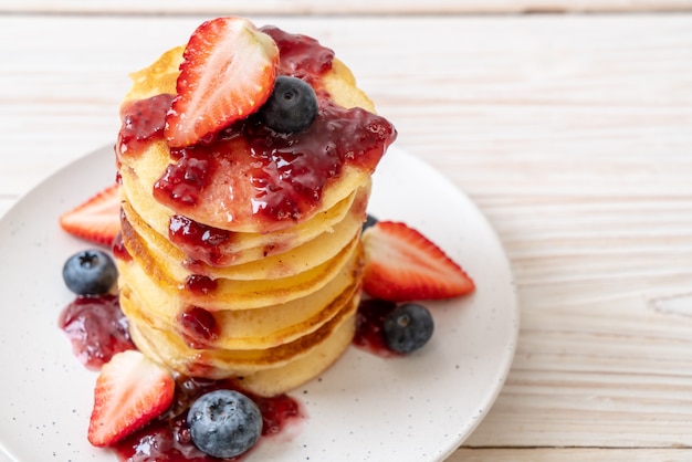 Premium Photo | Pancake with strawberries and blueberries