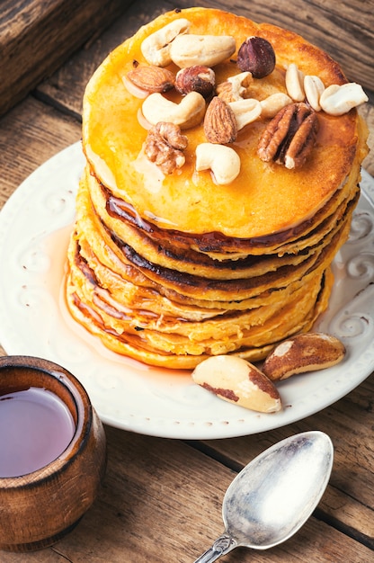 Premium Photo | Pancakes stack with nuts