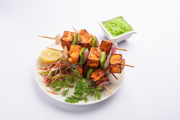 Premium Photo | Paneer tikka is an indian dish made from chunks of ...