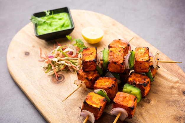 Premium Photo | Paneer tikka is an indian dish made from chunks of ...