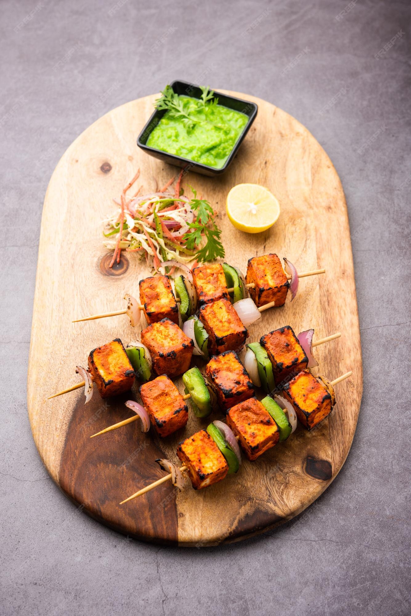 Premium Photo | Paneer tikka is an indian dish made from chunks of ...