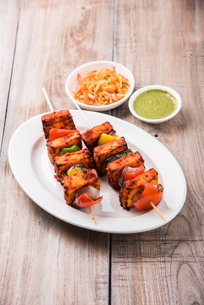 Premium Photo | Paneer Tikka Kabab In Red Sauce Is An Indian Dish Made ...