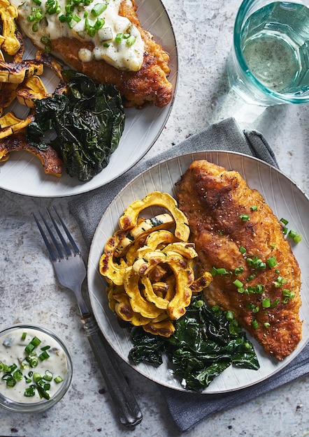 Premium Photo | Panfried catfish with squash and spinach