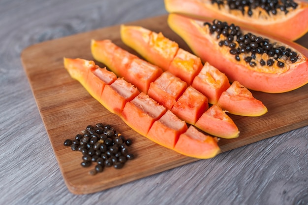 Premium Photo Papaya Fruit Cut In Slices On Wooden Background,Hognose Snake Baby