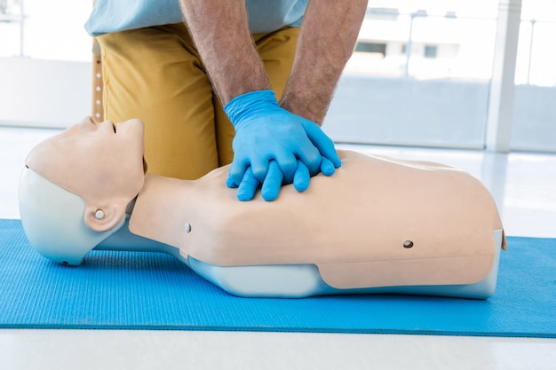 Premium Photo | Paramedic Practising Cardiopulmonary Resuscitation On Dummy