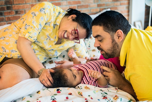 Parents take care of their kid family Premium Photo