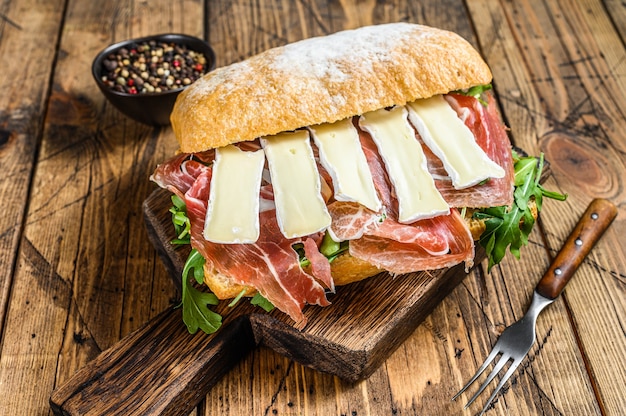 Premium Photo | Parma ham sandwich on ciabatta bread with arugula and ...