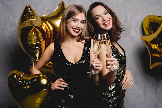 Premium Photo | Party fun. beautiful girls celebrating new year ...