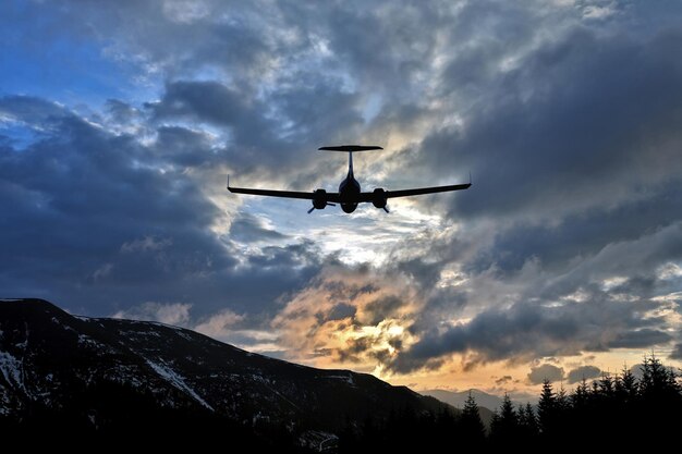 Premium Photo | Passenger plane flies in juicy clouds to meet the sun