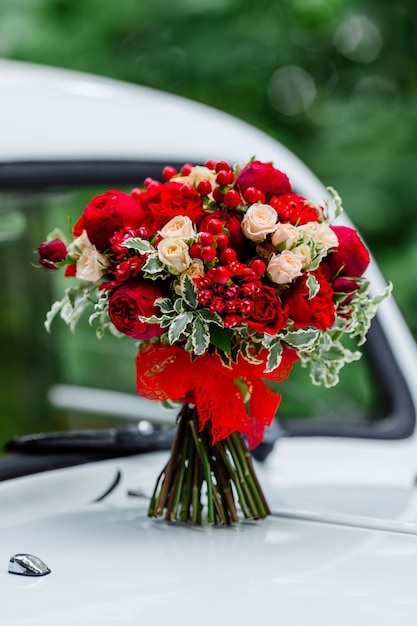 Passion wedding bouquet with dark red and marsala roses