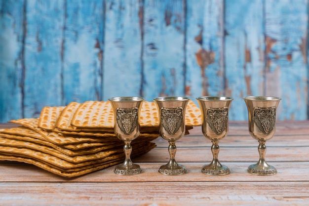 Premium Photo | Passover four glasses wine and matzoh jewish holiday ...