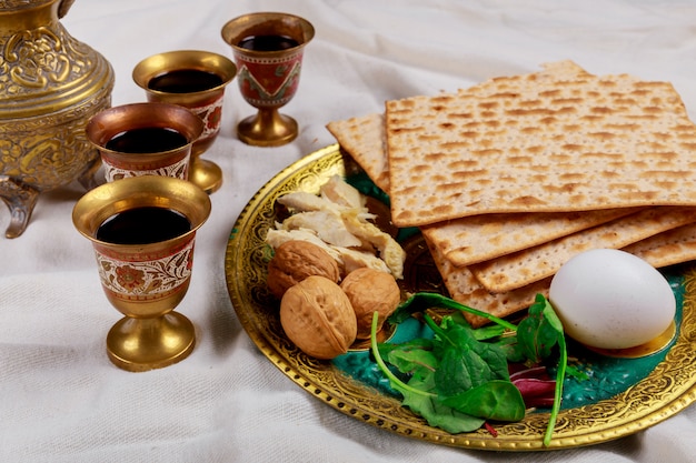 Premium Photo | Passover matzoh jewish holiday bread over table.