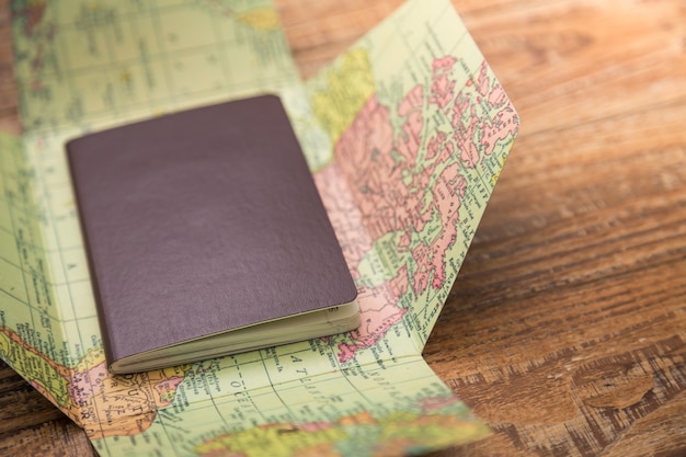 Free Photo | Passport on top of a world map