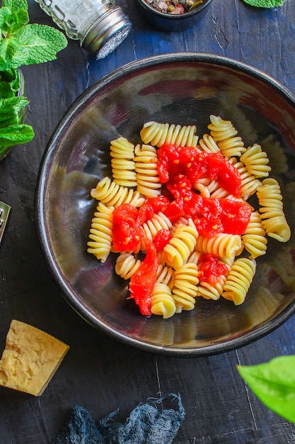 Premium Photo | Pasta rotini tomato sauce