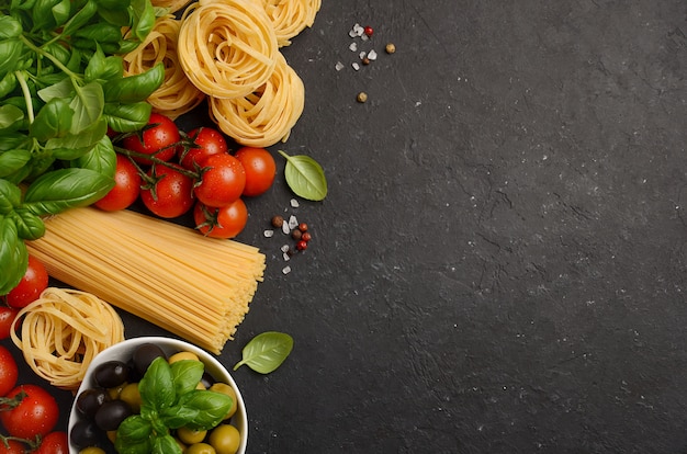 Premium Photo | Pasta, vegetables, herbs and spices for italian food on ...