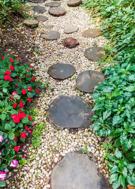 Premium Photo | Pathway with wood step in garden