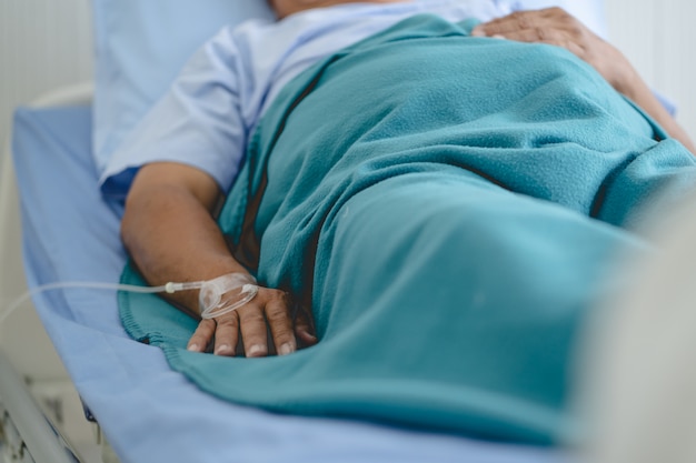 Premium Photo | Patient lying on the bed and resting in hospital.