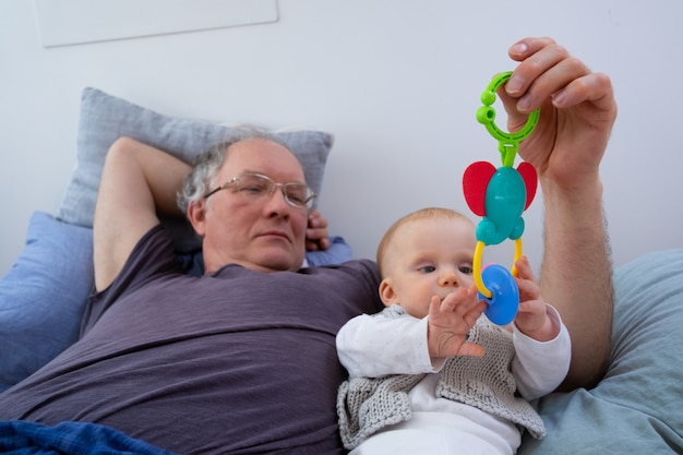 baby holding rattle