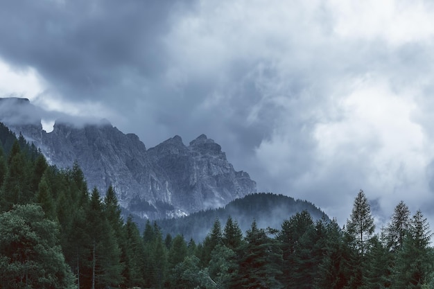 Premium Photo | The peaks of the italian dolomites are covered with low ...