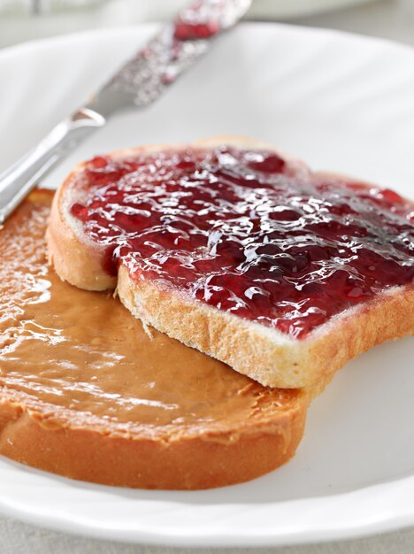 Premium Photo Peanut Butter And Jelly On Pieces Of Bread