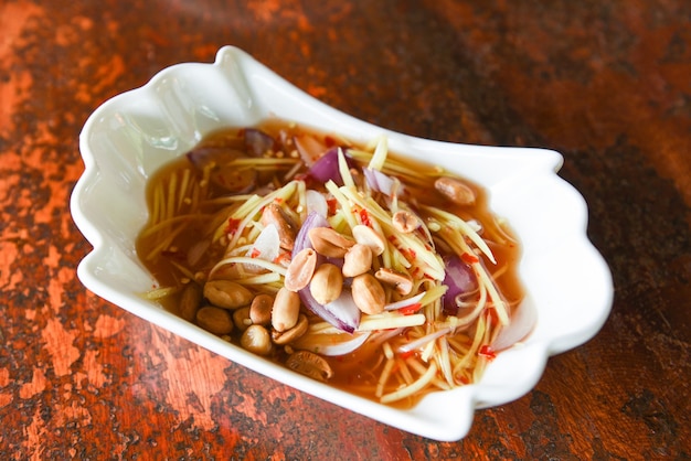 Premium Photo | Peanut salad with mango, spicy salad for sauce food