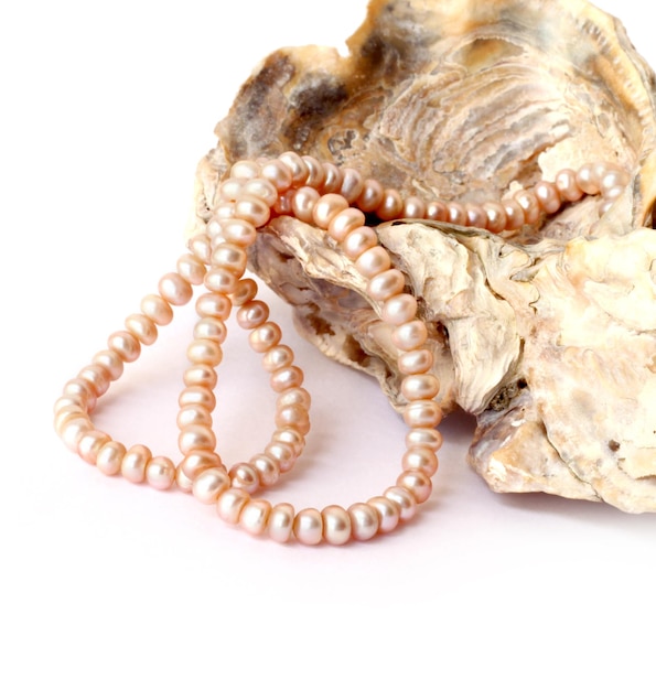 premium-photo-pearl-string-on-a-sea-shell