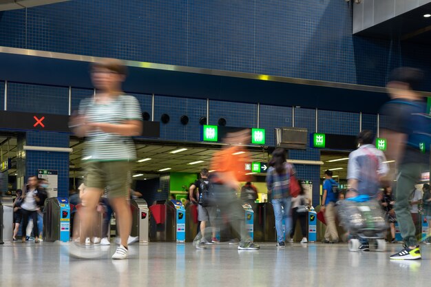 Premium Photo | Pedestrian commuter crowd busy train station people ...