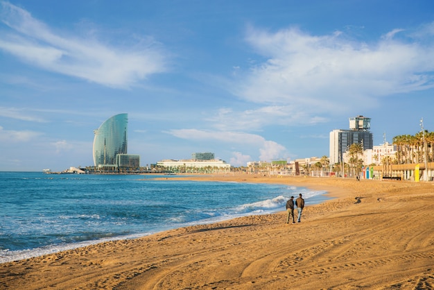 Premium Photo Pedestrians Walk Along Barceloneta Beach In Barcelona With Colorful Sky At Sunrise Seafront Beach Coast In Spain Suburb Of Barcelona Catalonia