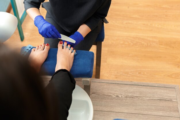 Premium Photo | Pedicure in beauty salon