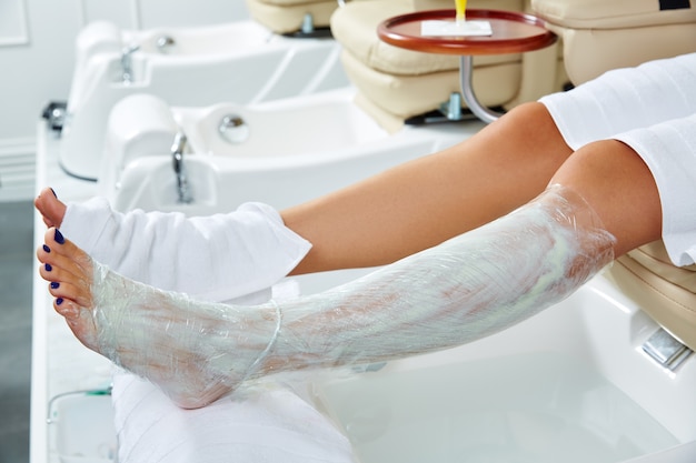 Pedicure nourishing mask legs cling film wrap Photo