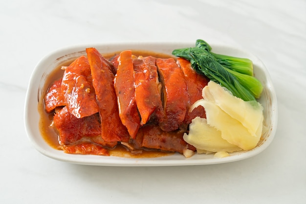 premium-photo-peking-duck-or-roasted-duck-in-barbecue-red-sauce