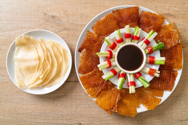 Premium Photo | Peking duck with sauce and ingredients