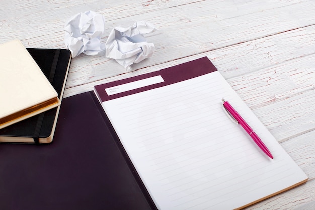 Free Photo | The Pen,notebooks And Papers Stand On The Table