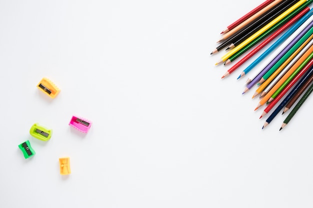 Pencils and sharpeners on white background Free Photo