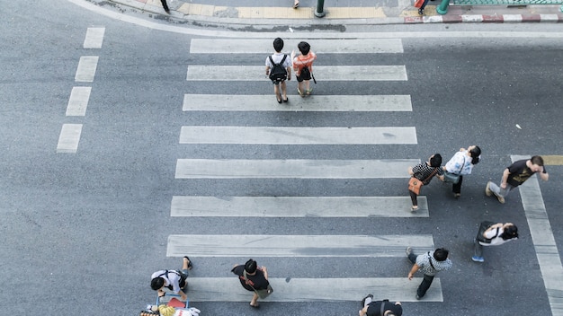 Premium Photo | People across the crosswalk on top view in pedestrian ...