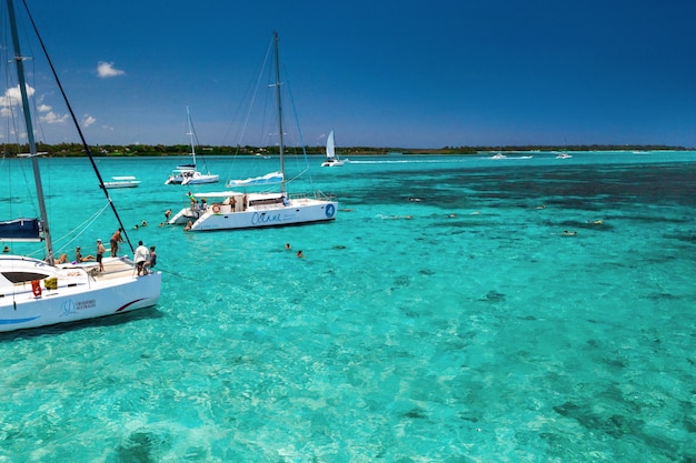 Premium Photo | People on catamarans swim in a lagoon on the east coast ...