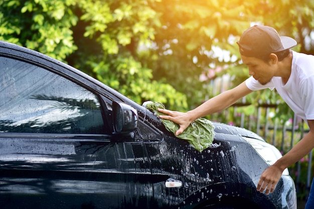 People cleaning car at home sunlight Premium Photo