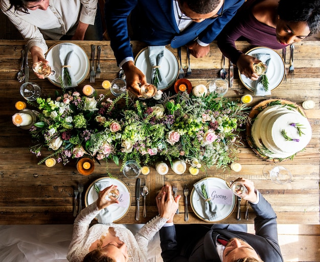 People Cling Wine Glasses On Wedding Reception With Bride And