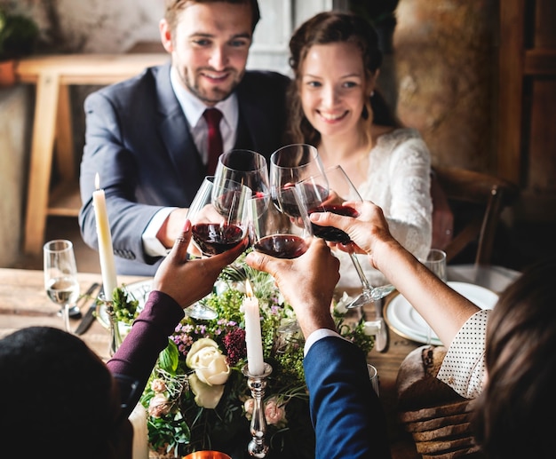 People Cling Wine Glasses On Wedding Reception With Bride And