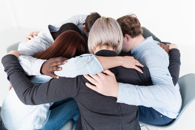 People embracing and gathering in a circle | Free Photo