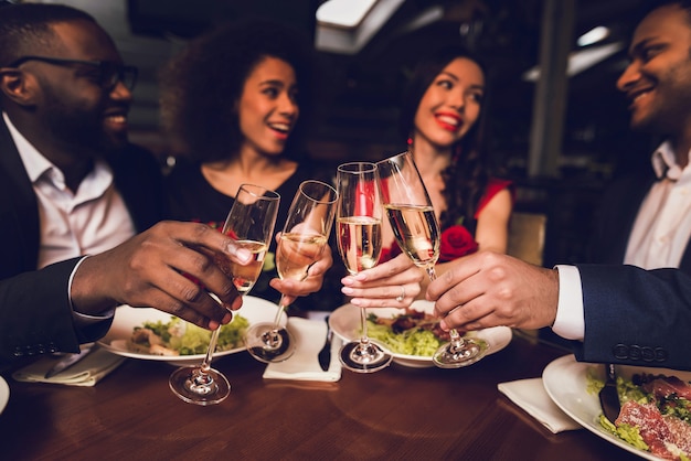 Premium Photo | People gathered in the restaurant rest and drink wine.