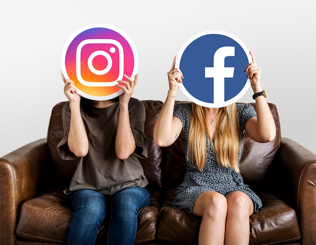 People holding social media icons Free Photo