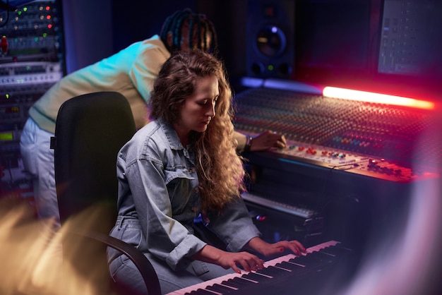 Premium Photo | People playing musical instruments in studio