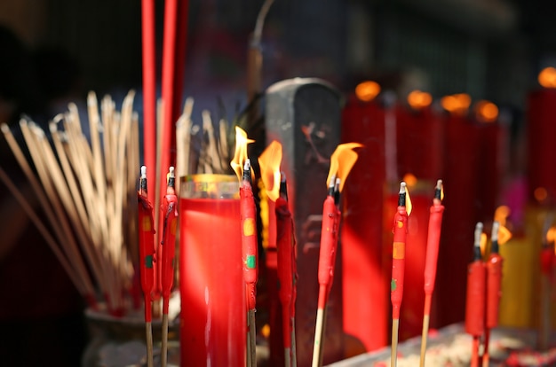 Premium Photo | People pray respect with incense burning for god in chinese  new year day.