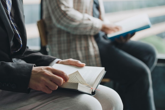 Premium Photo | People reading the holy bible. two man reading a book ...